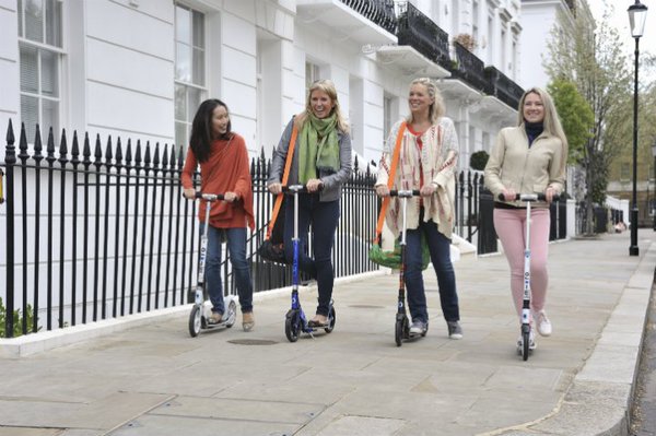 adults on scooters
