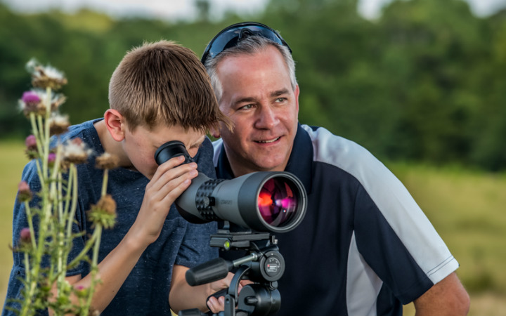 father and son with scope