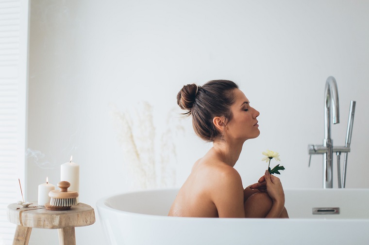 picture of a topples woman in a hot bath in the bathroom 