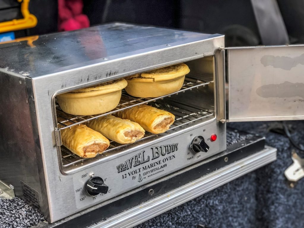 This small and space-saving device allows you to reheat, bake, or roast while driving using the 12V battery system in your car or a 12V dual battery system. Put your stew, roast, pies, or pasties in this unit and they'll be ready to eat when you get there. This oven is made of heavy-duty stainless steel and has little heat transmission to the outside, making it ideal for the travelling lifestyle. The 12 Volt Travel Oven includes an insulated door for optimal heat retention and a port latch to prevent it from opening while travelling.