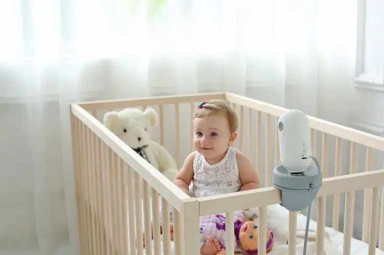 picture of a baby in its cottage with baby monitor