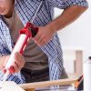 man working with industrial adhesive