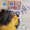 kid playing with magnetic toys on the floor